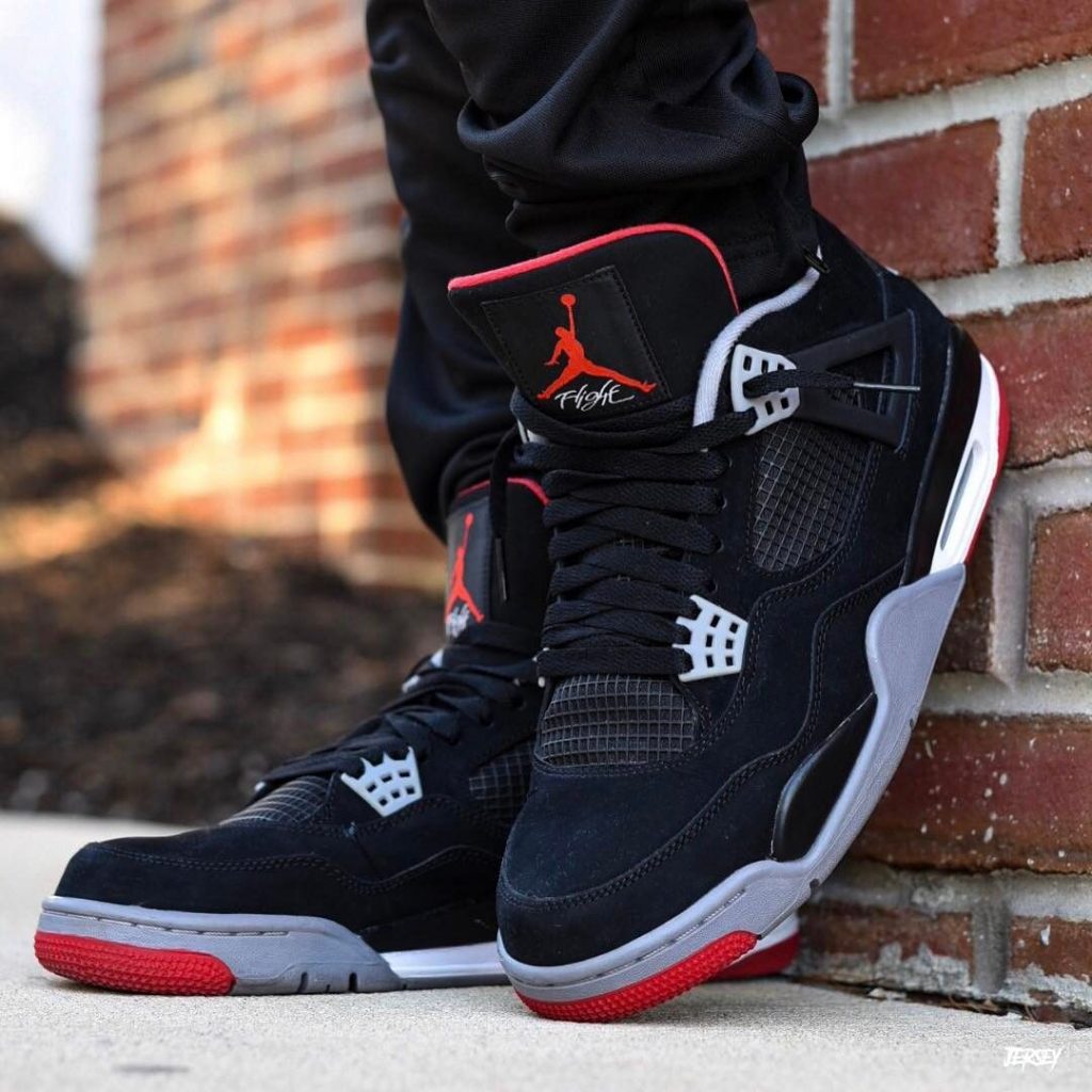 Someone wearing the Air Jordan 4 Bred